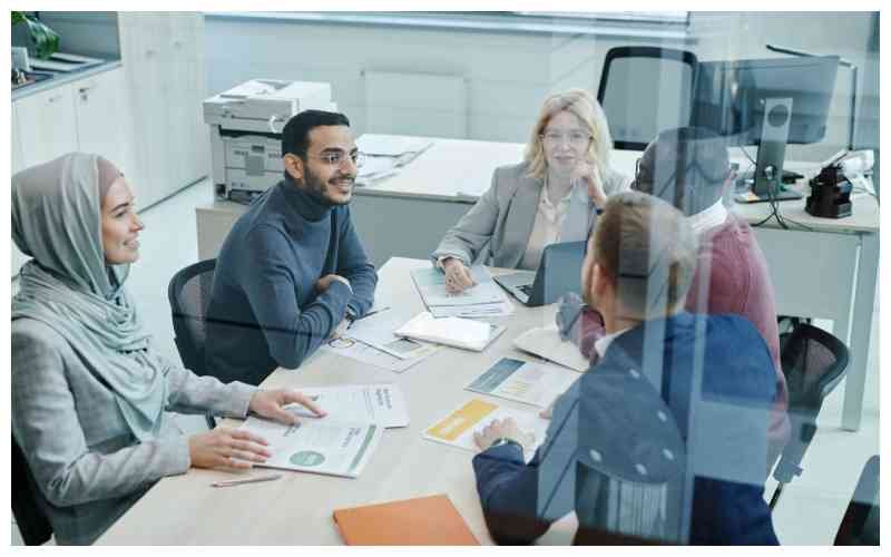 Modern conference room meeting with video conferencing setup